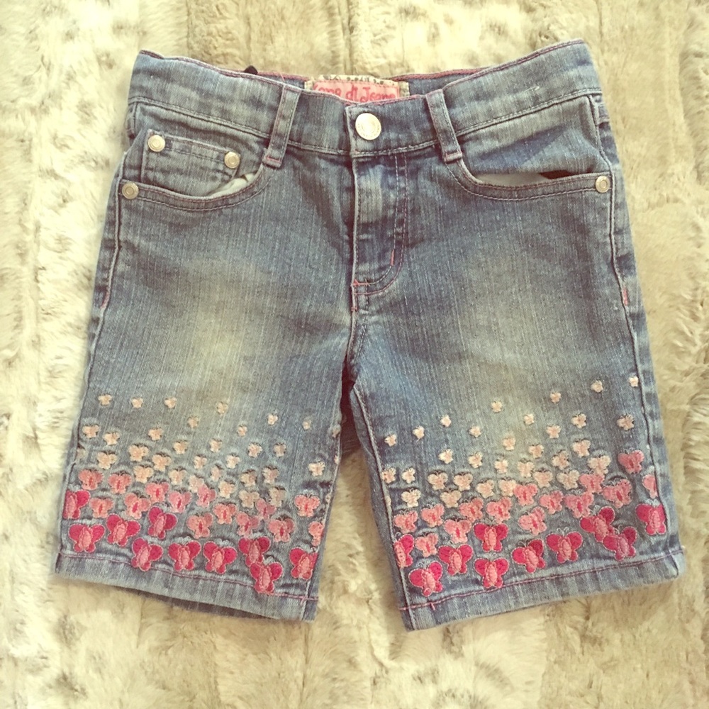 Denim shorts with pink accents